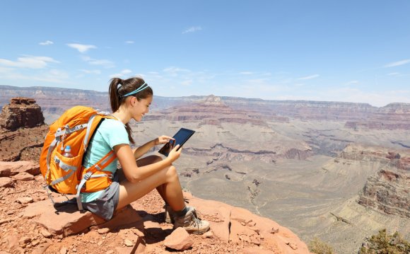 Tablet computer woman hiking
